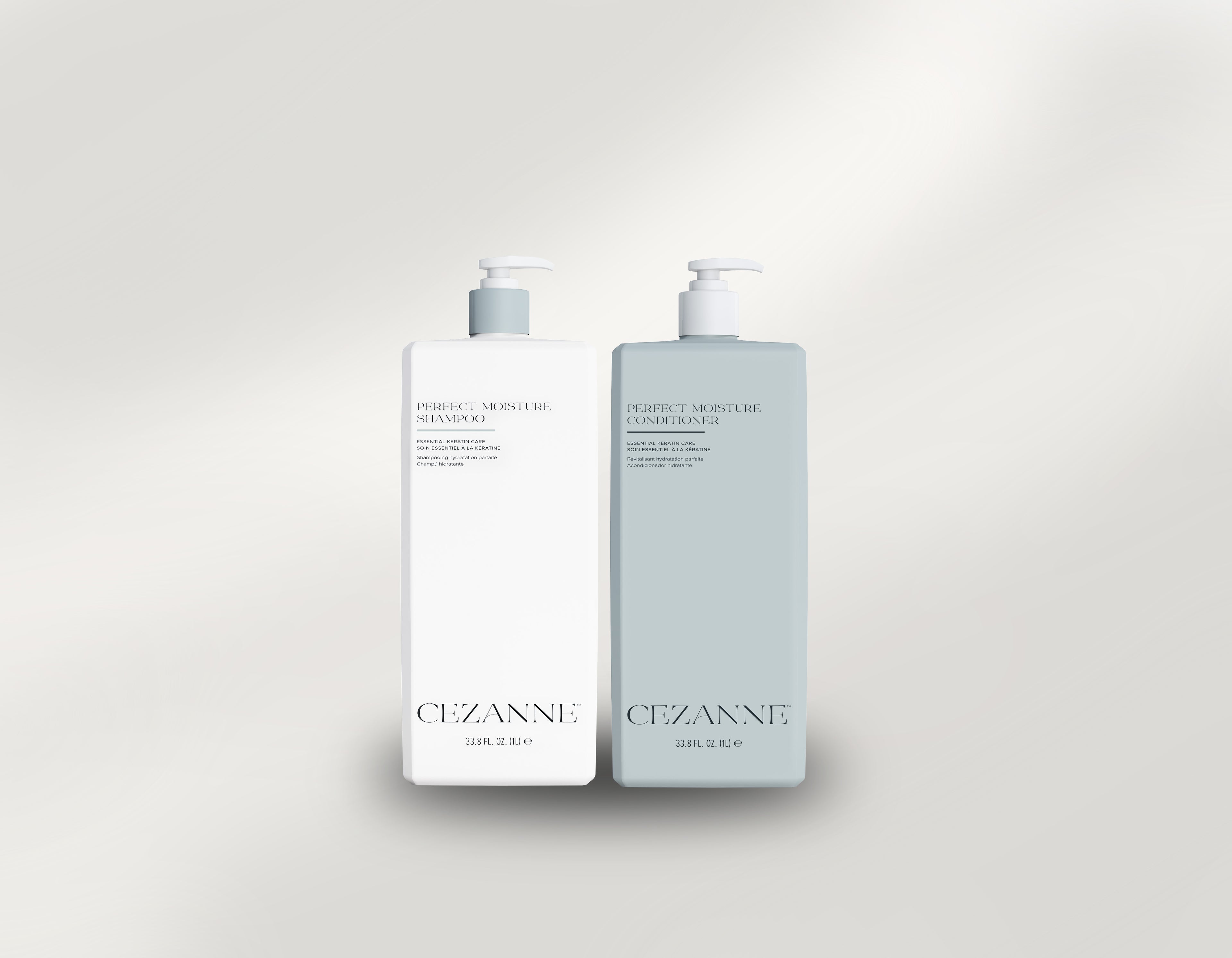 Two bottles of Cezanne Perfect Moisture  Shampoo and Conditioner on a light gray background